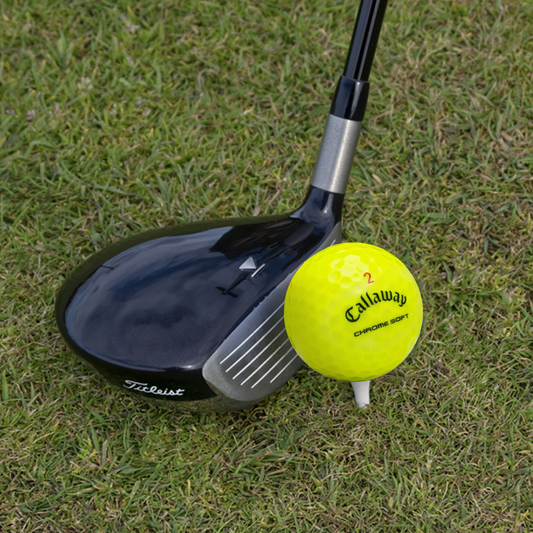 Used Callaway Triple Track Mix golf ball on the course, yellow