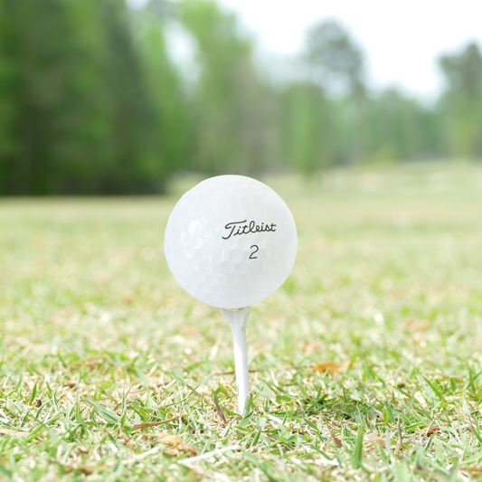 Titleist Pro V1 2025 recycled golf ball resting on a putting green