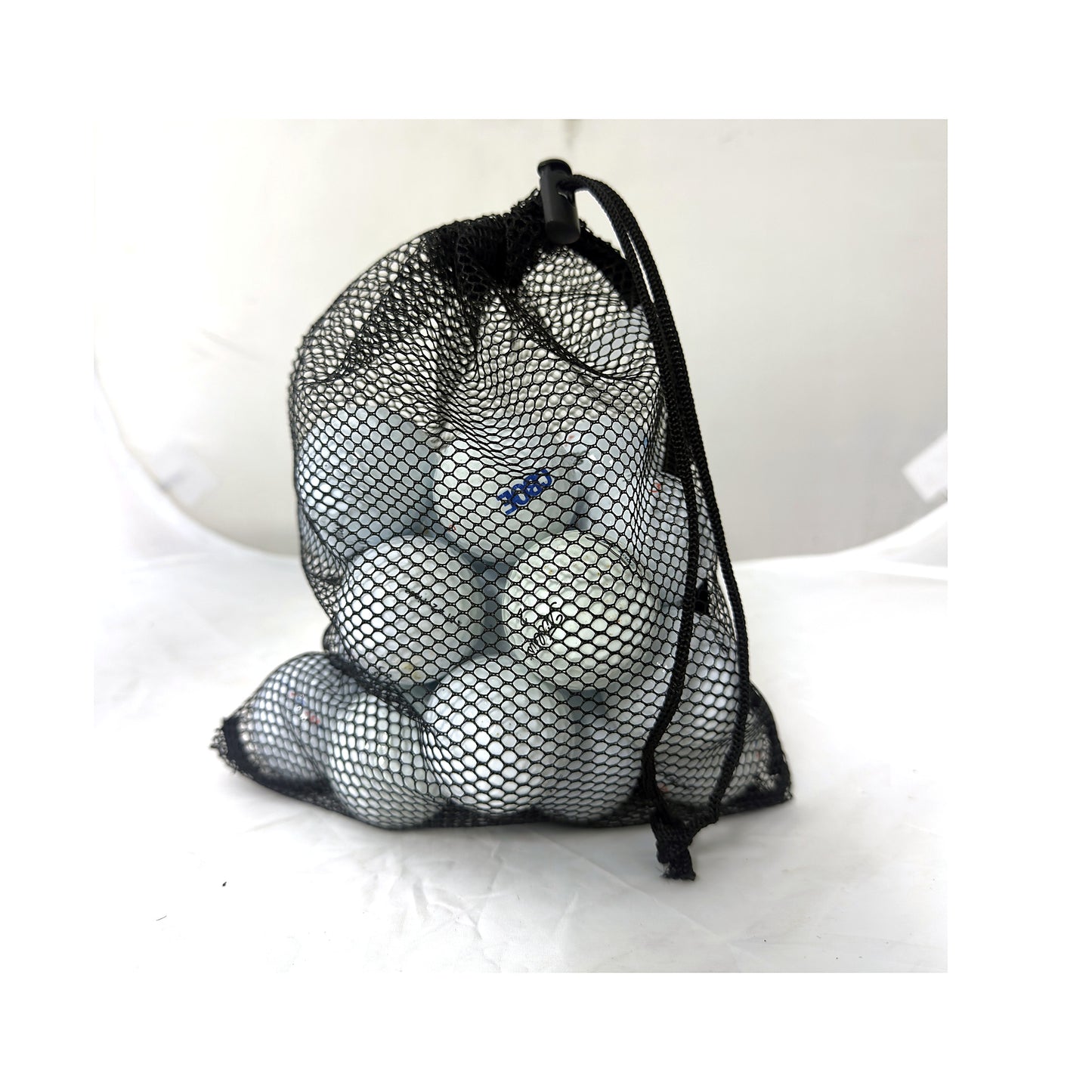 24 used Titleist mix golf balls in a Golf Ball Nut mesh bag, Value (3A) grade, white