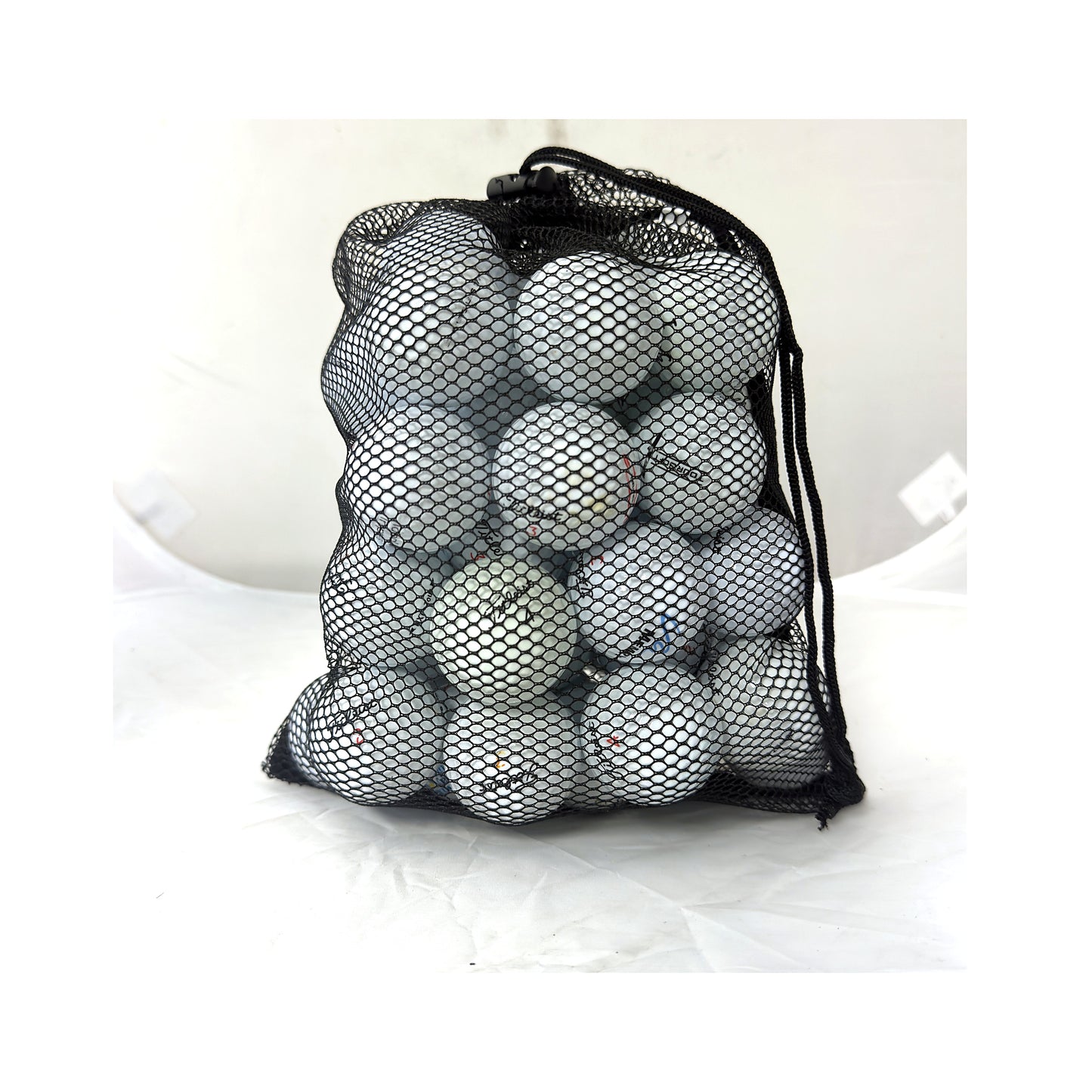 48 used Titleist mix golf balls in a Golf Ball Nut mesh bag, Value (3A) grade, white