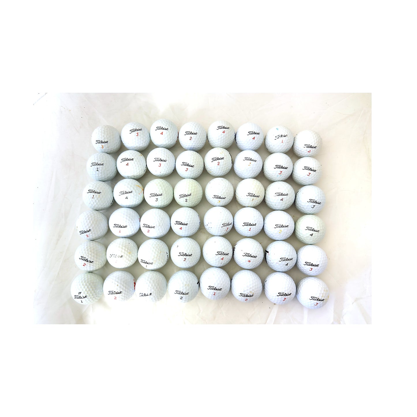 All 48 used Titleist mix golf balls laid out and counted, Value (3A) grade