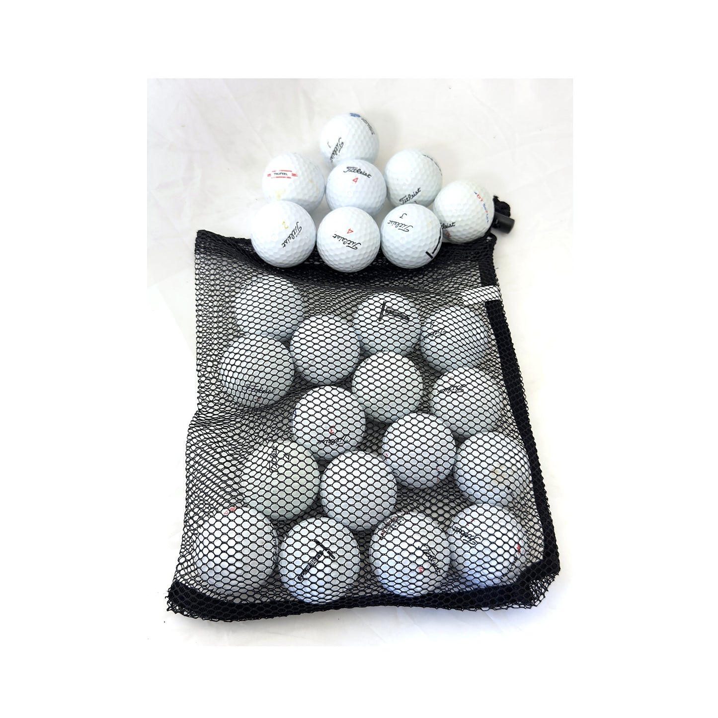 Open mesh bag of 24 used Titleist mix golf balls, Value (3A) grade, white