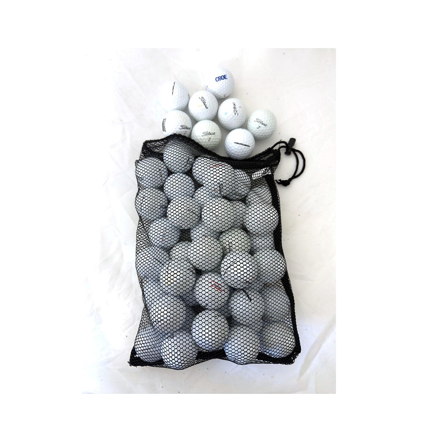 Open mesh bag of 48 used Titleist mix golf balls, Value (3A) grade, white