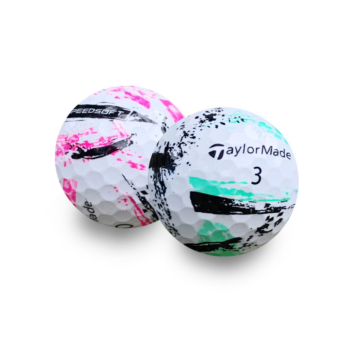Close-up of two used TaylorMade Speedsoft Ink golf balls showing the ink pattern